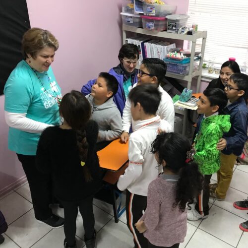Barb Worley spends time with children at Benjamin Franklin School