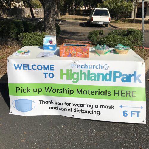 Table set up for outdoor services with individual communion packets and masks
