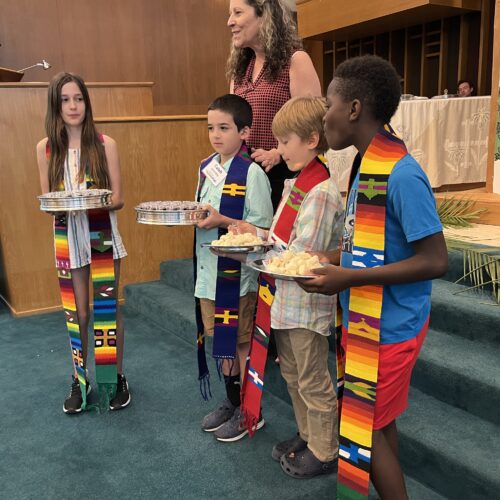 children serving communion