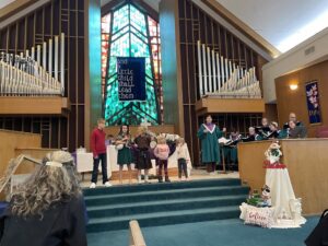 HP Kids sing "Little Drummer Boy" on the altar steps on the first sunday of advent