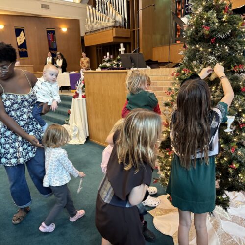 The children of Highland Park put Chrismons on the tree